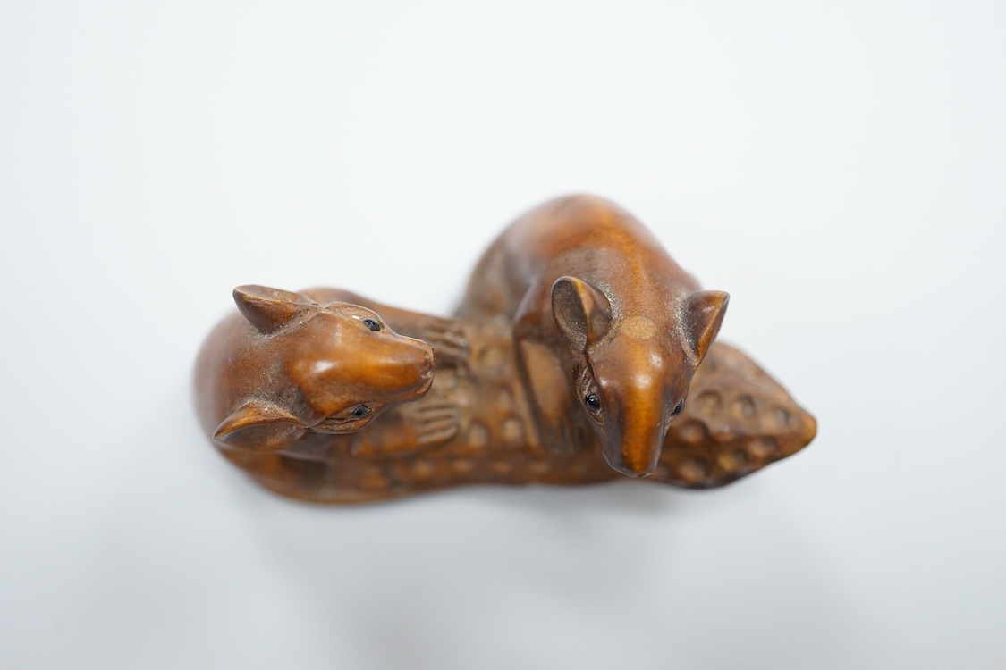 Three carved hardwood netsuke, signed